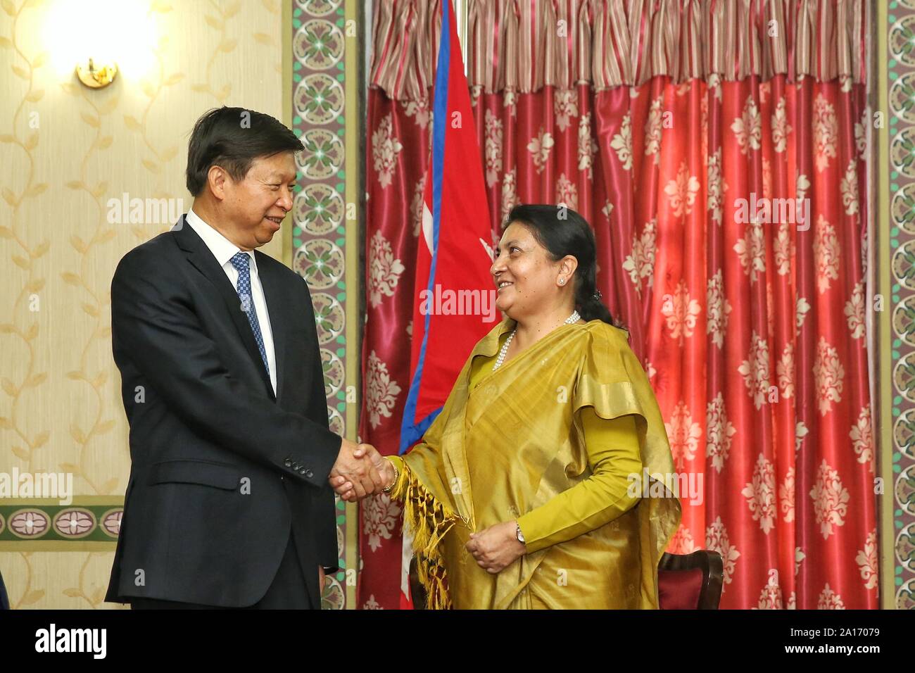 Kathmandu, Nepal. 24th Sep, 2019. Nepalese President Bidhya Devi Bhandari shakes hands with Song Tao, head of the International Department of the Communist Party of China (CPC) Central Committee, in Kathmandu, Nepal, on Sept. 24, 2019. Credit: Sulav Shrestha/Xinhua Stock Photo