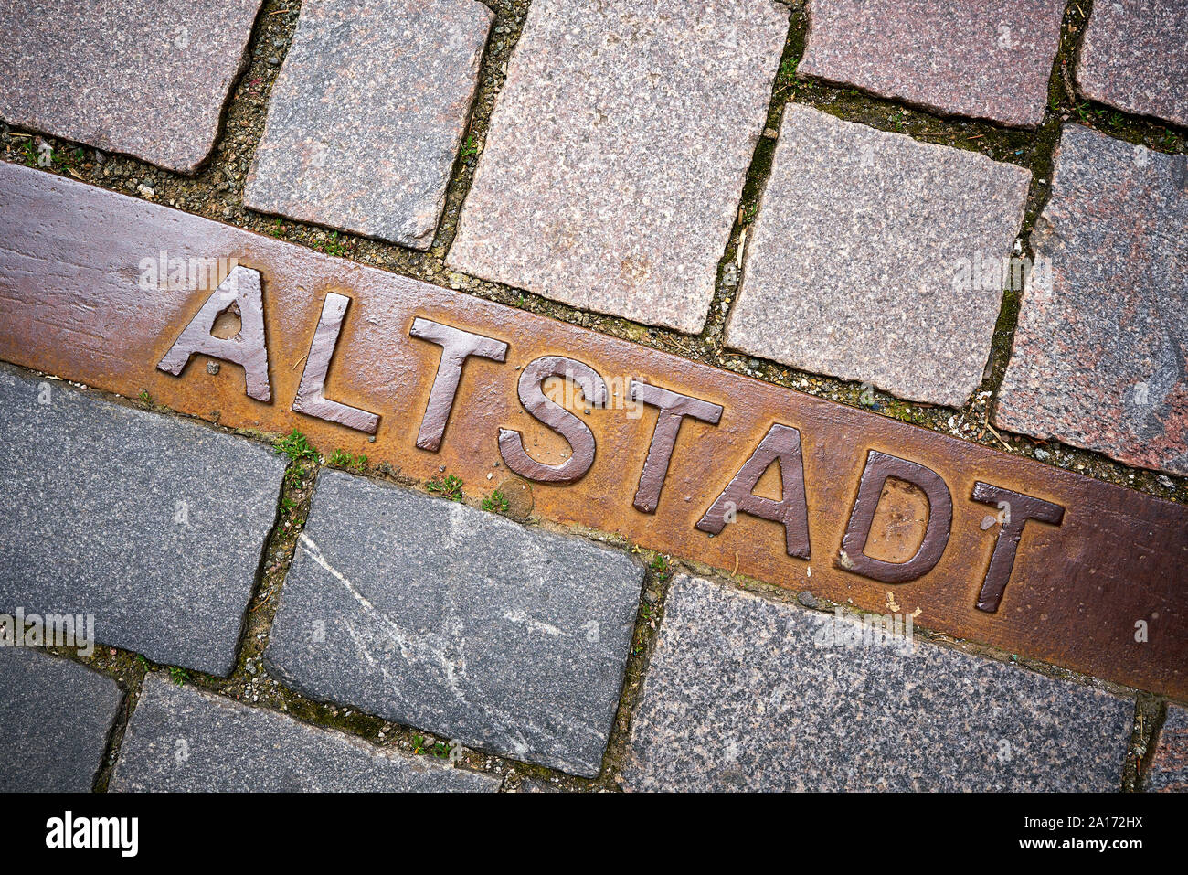 Marking the historic old town on the cobblestones of the town Schmalkalden in Thuringia with the words 'Altstadt' Stock Photo
