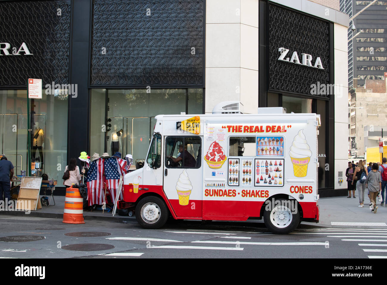 Ice cream trucks delivering sundaes, shakes and cones in front of zara shop, Financial Distict, Lower Manhattan, New York City, NYC, USA Stock Photo