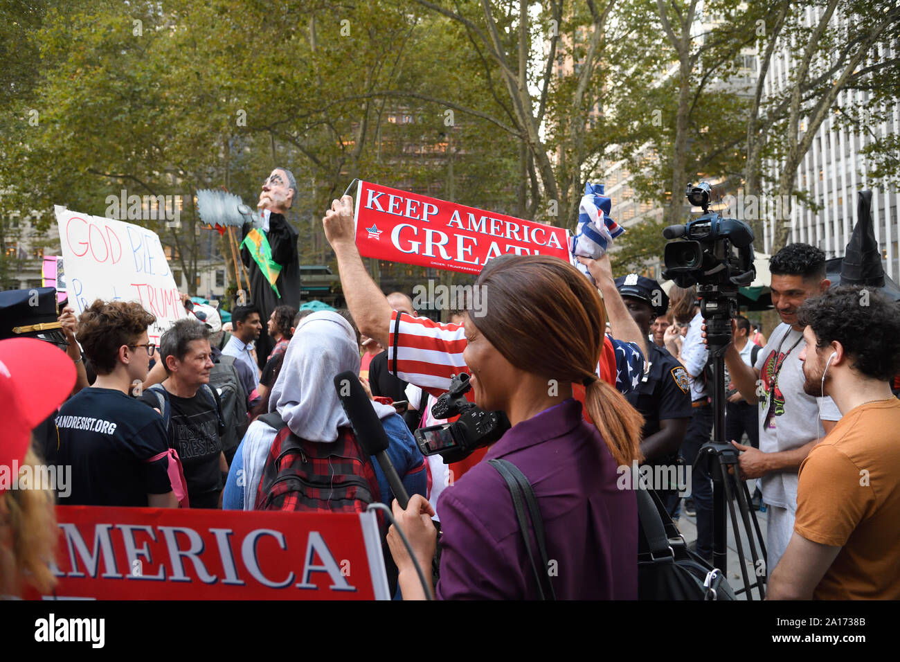 Anti Trump protesters confronted by President Trump supporter during the Rise and Resist - United in Outrage, a Resistance March along Fifth Avenue. Stock Photo