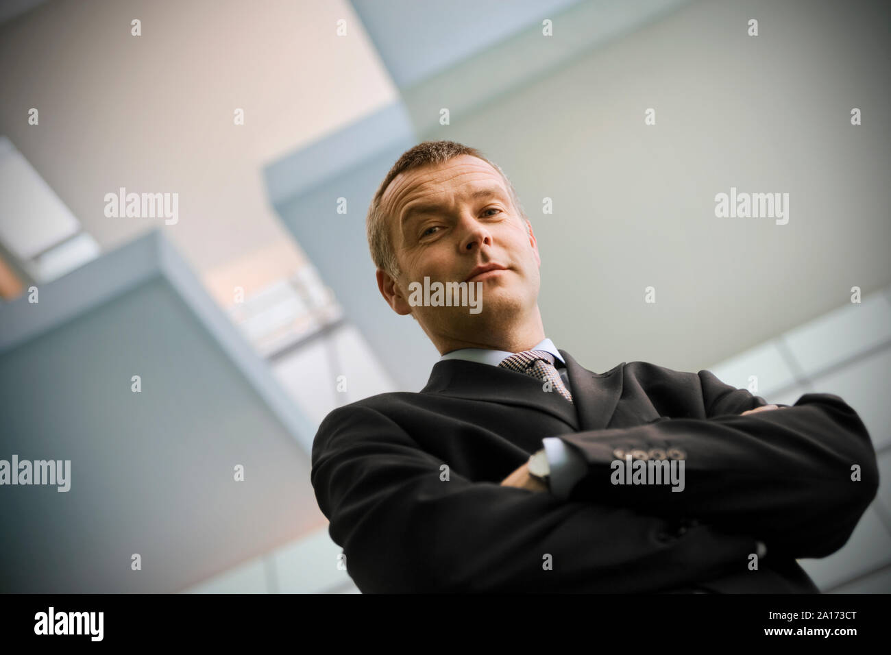 Portrait of a businessman with his arms crossed Stock Photo - Alamy