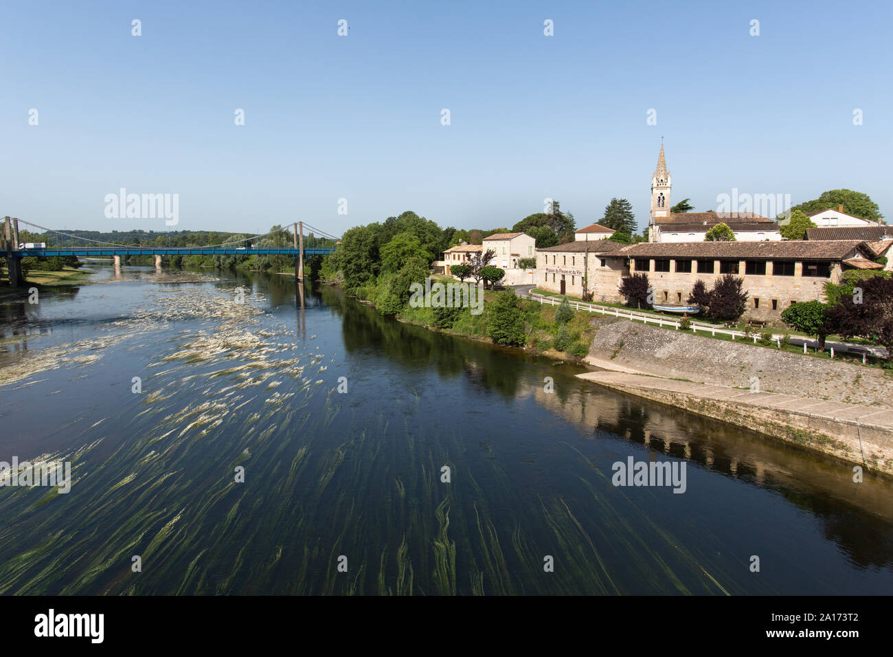 Sainte-Foy-la-Grande, France. Picturesque view of the Dordogne River viewed from the Rue du Pont Bridge, with Port Sainte-Foy on the right. Stock Photo