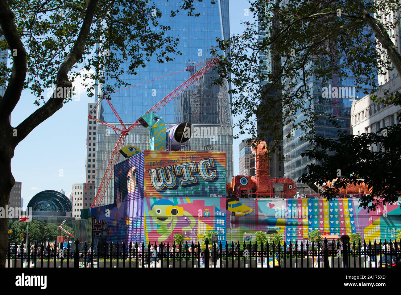 The colorful murals of the World Trade Center (WTC) with the fence of the cemetery of St. Paul's Chapel.Die bunten Wandmalereien des World Trade Center Stock Photo