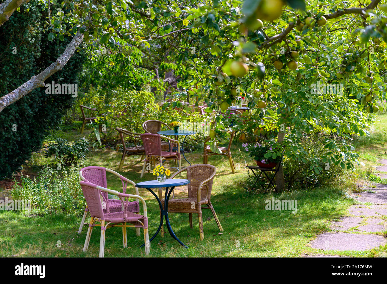 Cozy sitting areas made of wicker chairs and tables in a romantic
