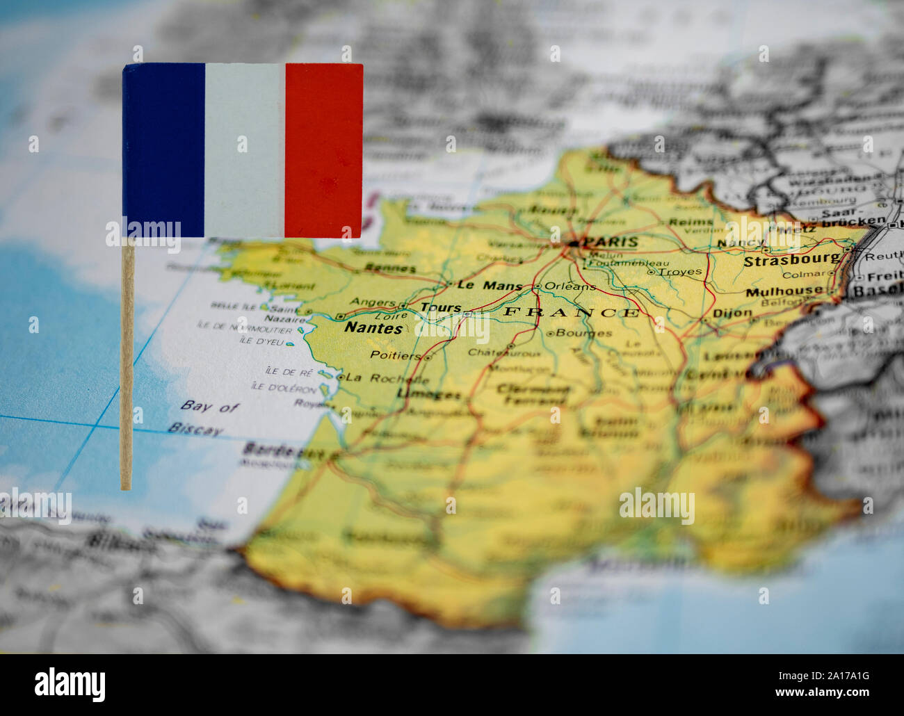 map of France with the national flag at front Stock Photo