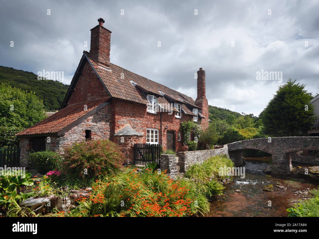 Stone cottage and bridge at Allerford village. Exmoor National Park. Somerset. UK. Stock Photo
