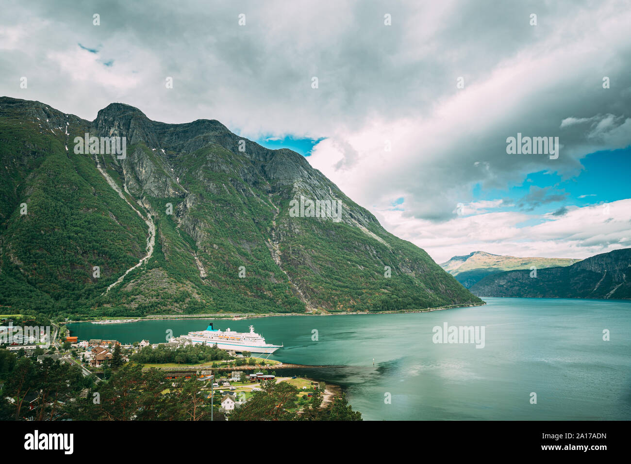 Eidfjord, Norway. Touristic Ship Or Ferry Boat Boat Liner Moored Near Harbour In Summer Day. Aerial View Of Famous Norwegian Landmark And Popular Dest Stock Photo