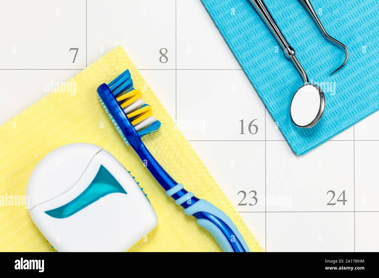 Dentist appointment date on calendar with toothbrush floss and tools dental appointment concept. Stock Photo