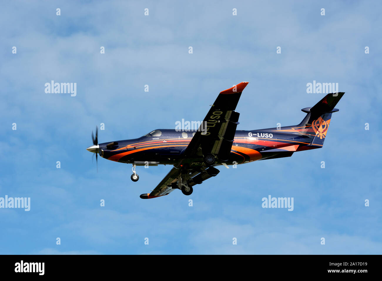 Pilatus PC12/47E landing at Birmingham Airport, UK (G-LUSO) Stock Photo