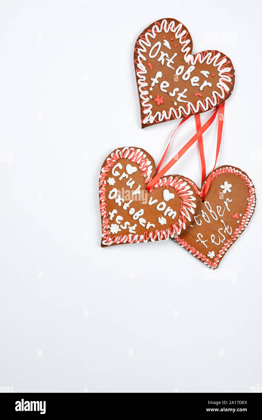 The gingerbread hearts with Oktoberfest inscription on white background Stock Photo