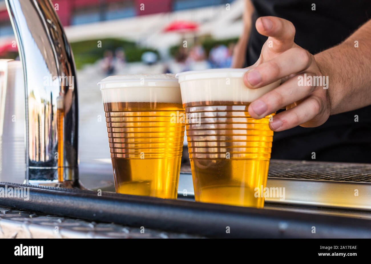 Serving cold beer at a street food market. Stock Photo