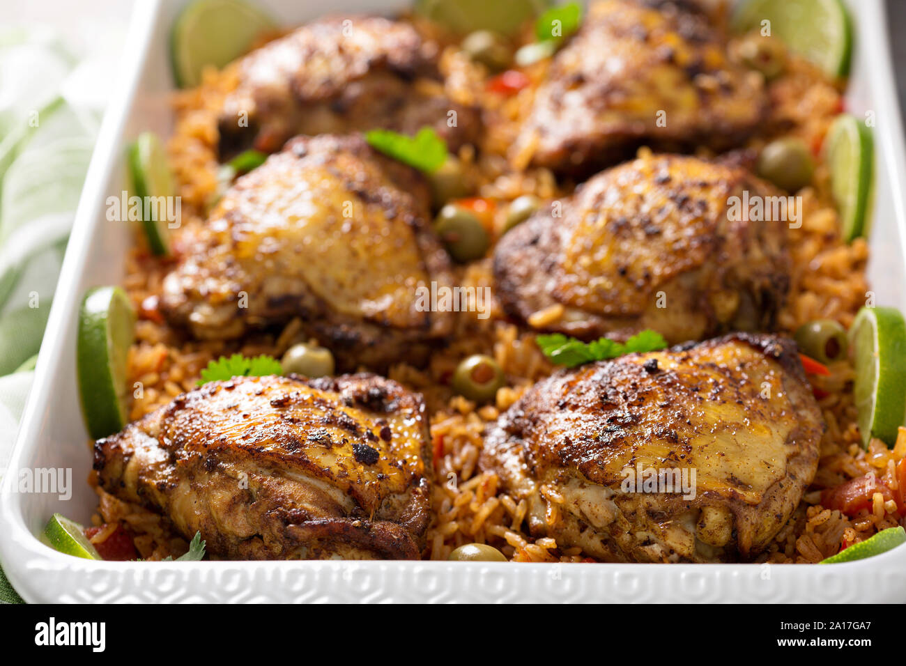 Arroz con pollo, roasted chicken with rice in a baking dish Stock Photo