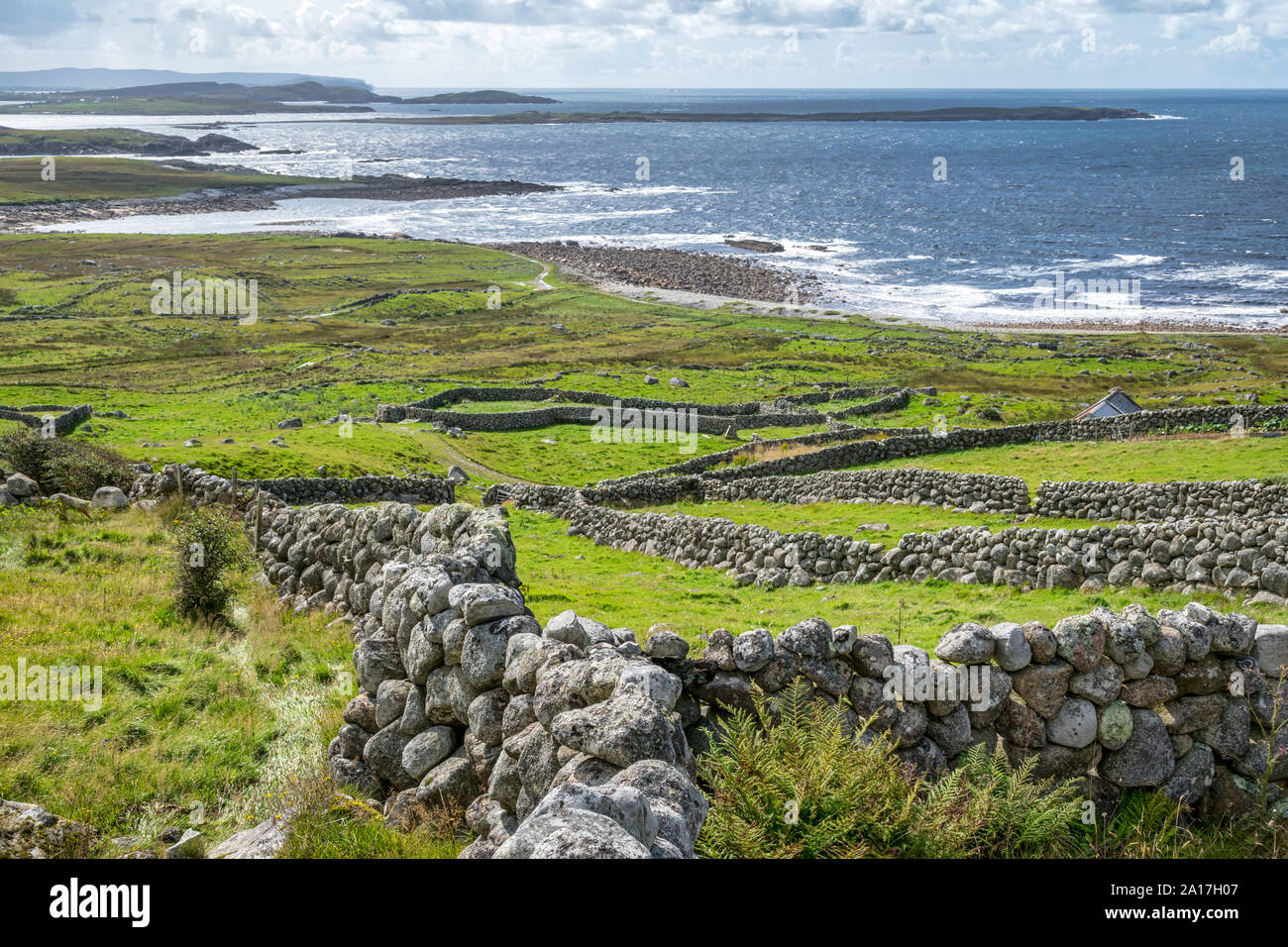 Old stone walls and the Atlantic Ocean in Doenegal Ireland Stock Photo
