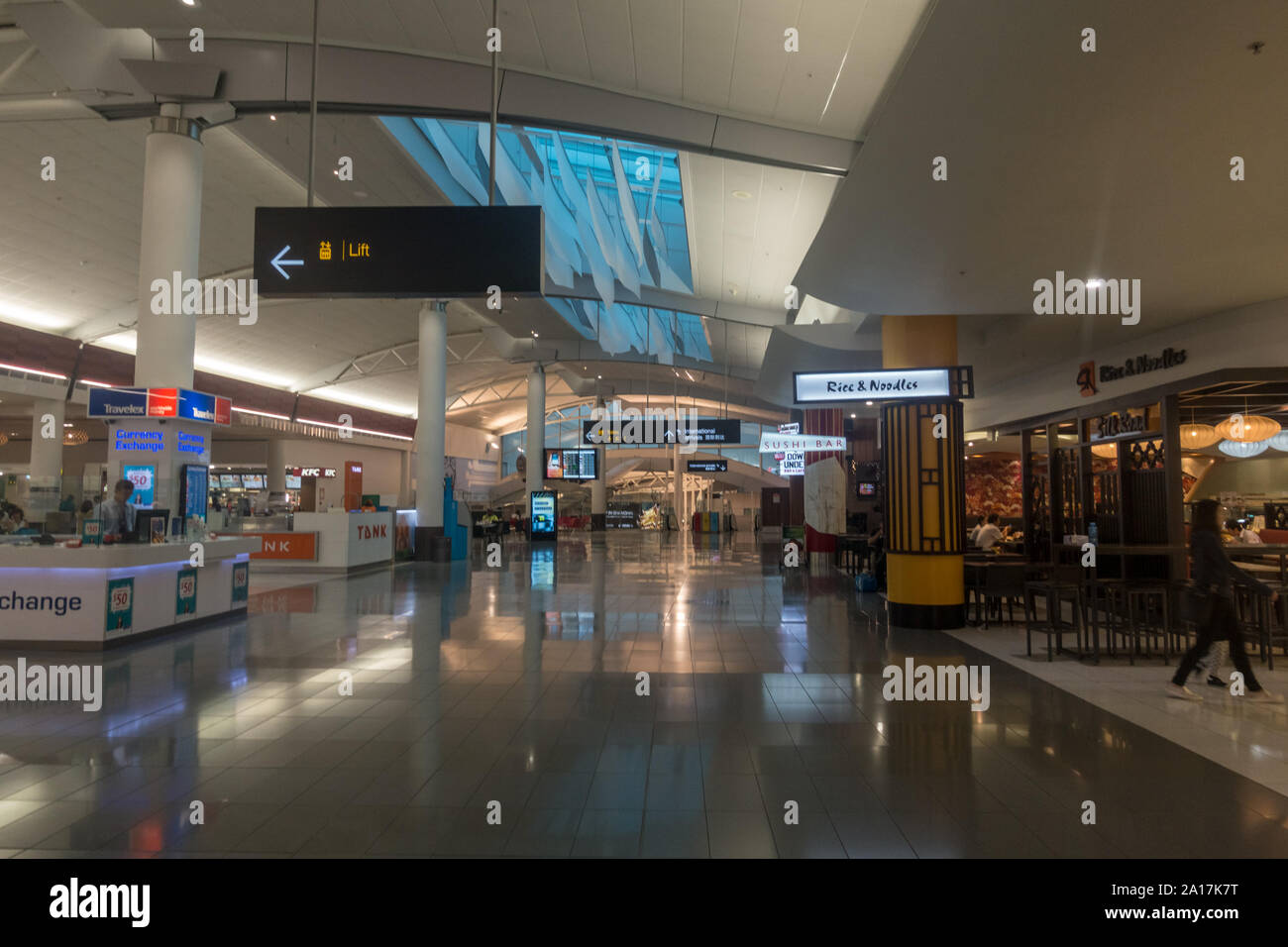 AUCKLAND - DEC 15 2016: Passengers passing through the new Auckland airport Stock Photo