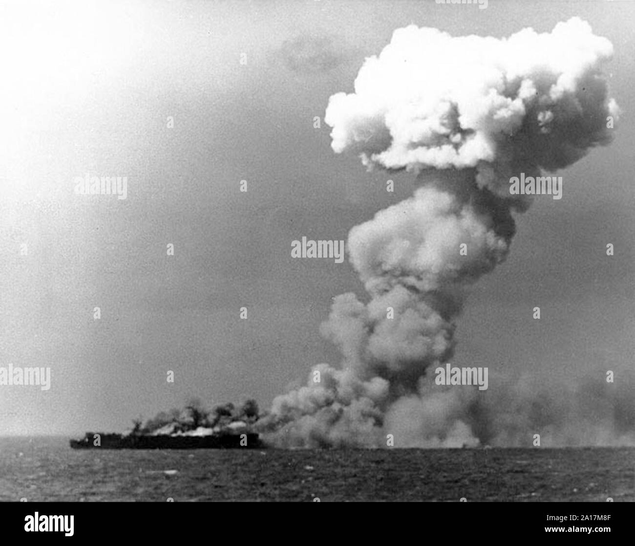 The Battle of Leyte Gulf, the largest naval battle of World War II. The U.S. Navy light aircraft carrier USS Princeton (CVL-23) burning soon after she was hit by a Japanese bomb while operating off the Philippines on 24 October 1944 Stock Photo