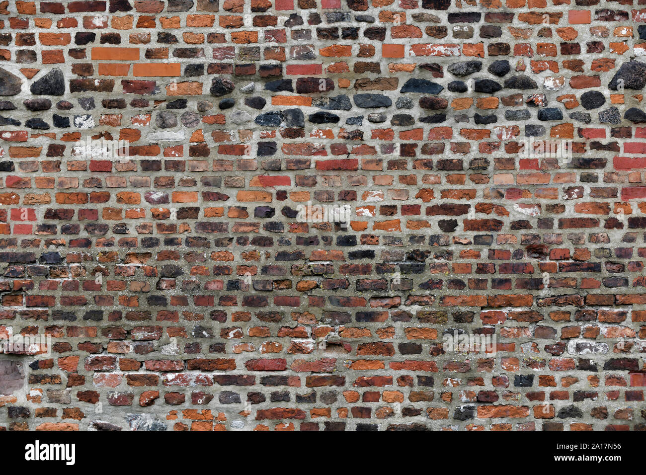 Old Red Brick Wall with Lots of Texture and Color. Stock Photo
