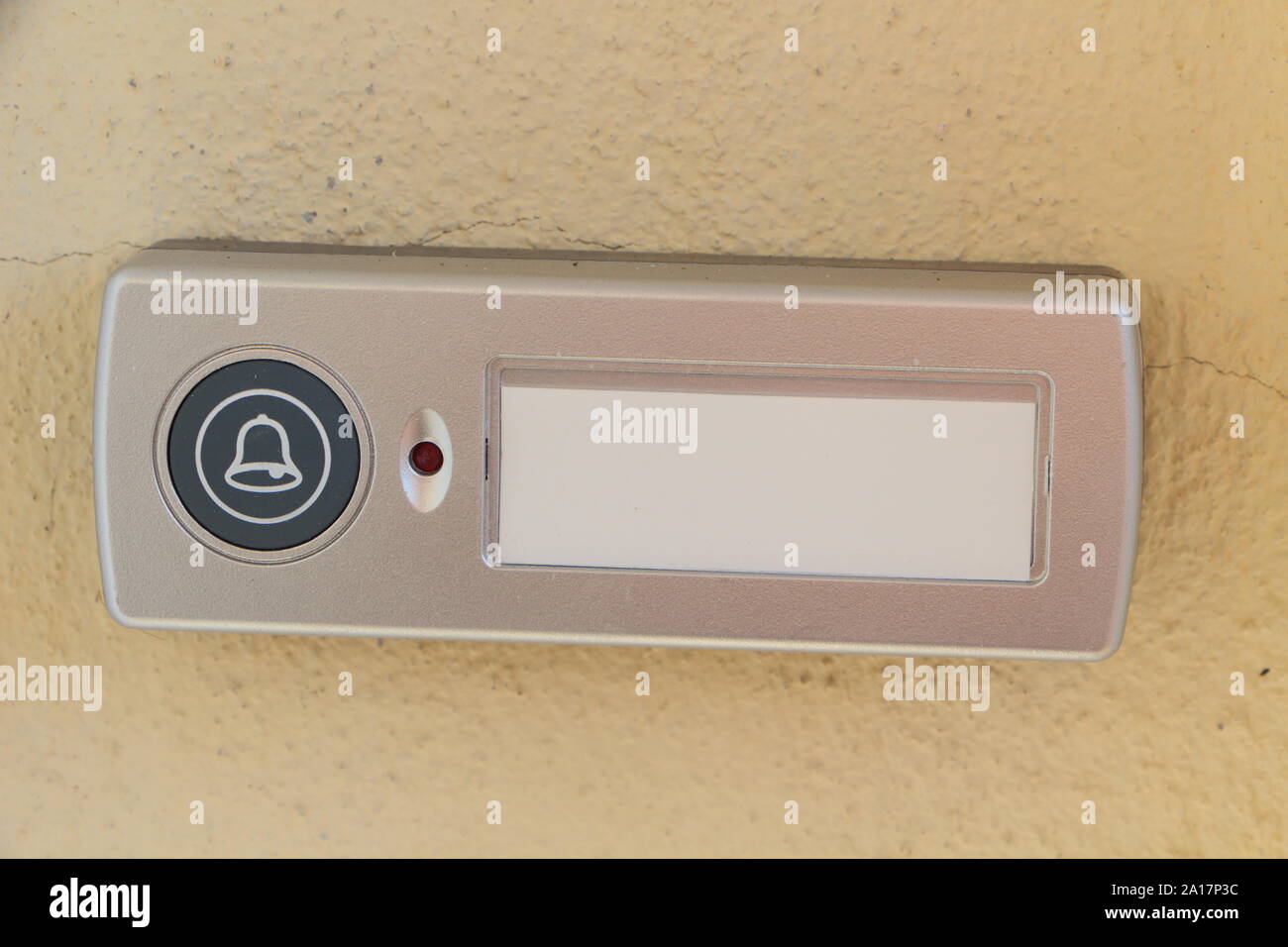 Doorbell on the wall of an house Stock Photo