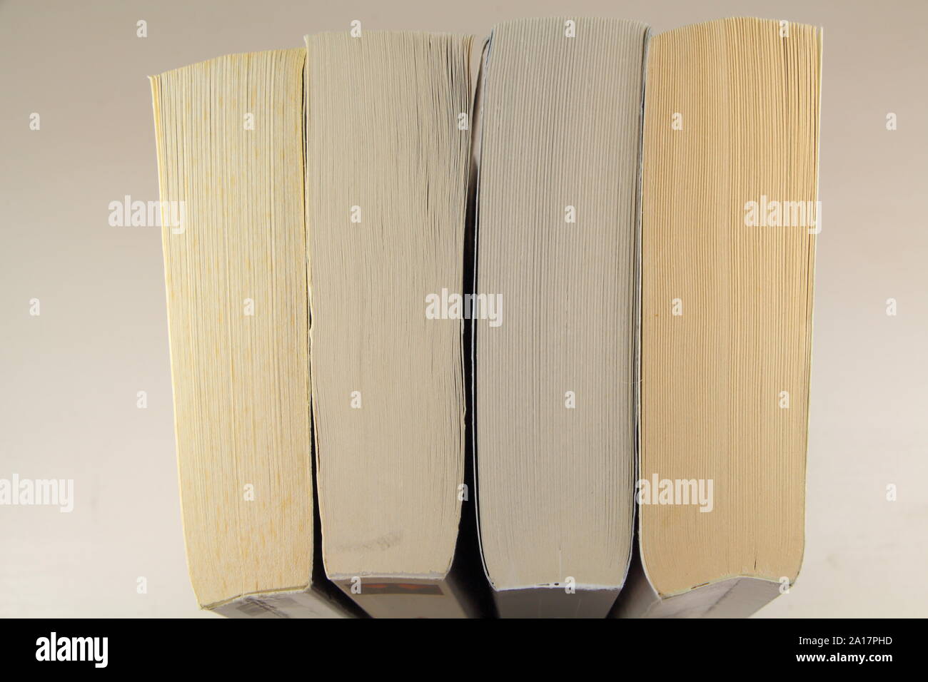 View on the top of four paperbacks on a table Stock Photo