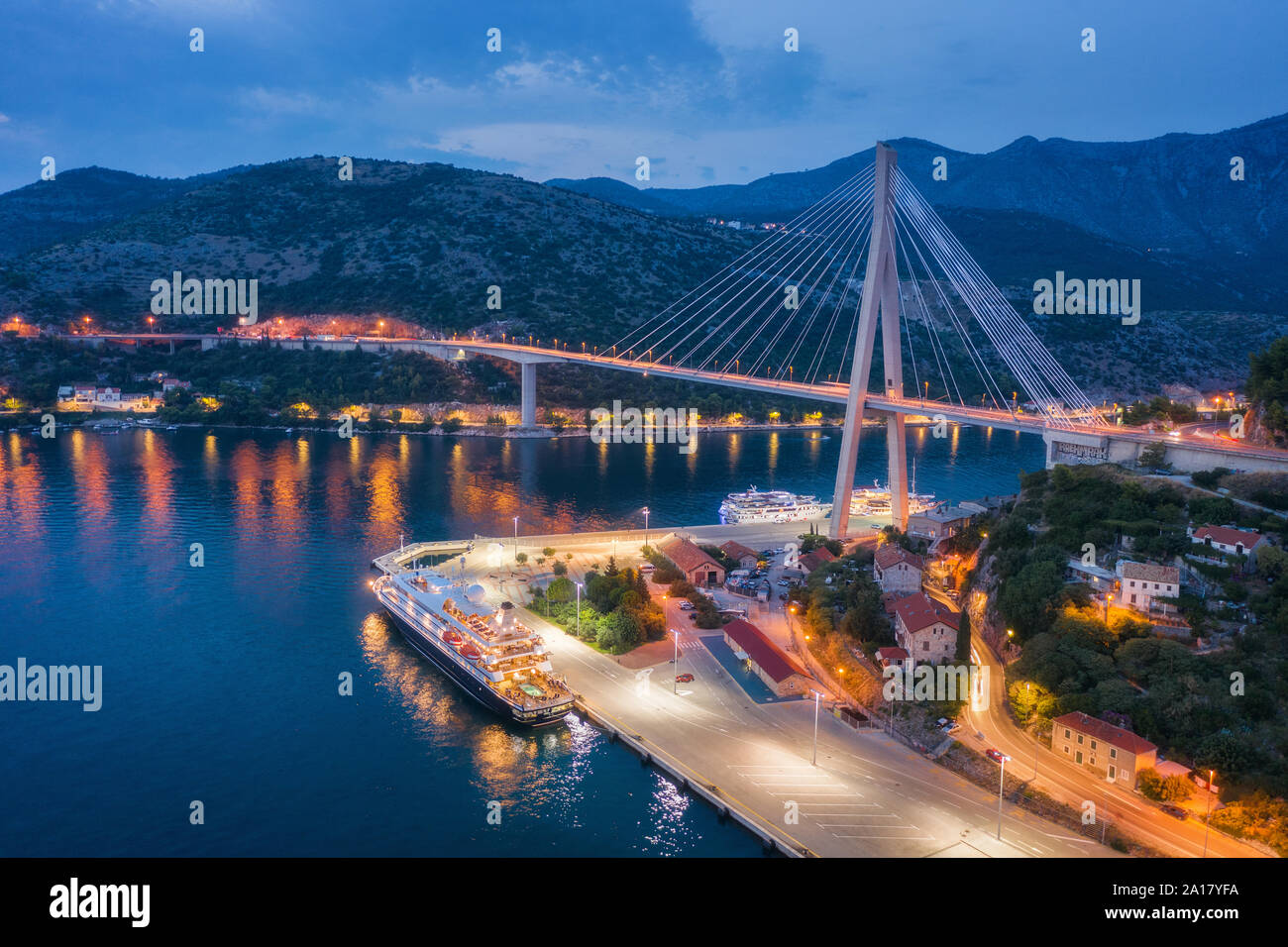 Aerial view of cruise ship at harbor and bridge at night Stock Photo ...