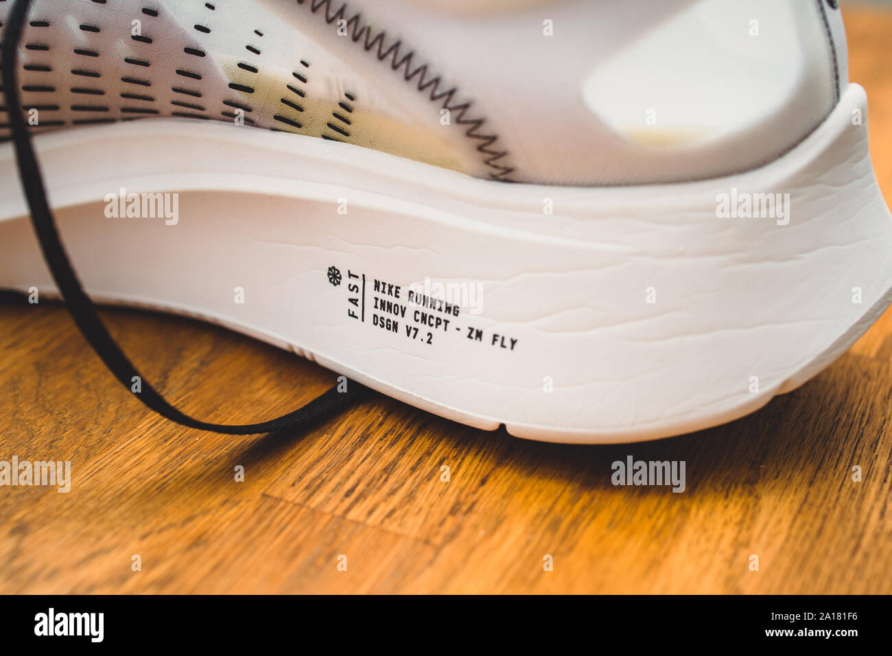 Paris, France - Jul 8, 2019: close-up macro shot of new professional Nike  running sport shoe on wooden floor Nike Zoom Fly SP FInnovation concept  DSGN V7.2 Stock Photo - Alamy