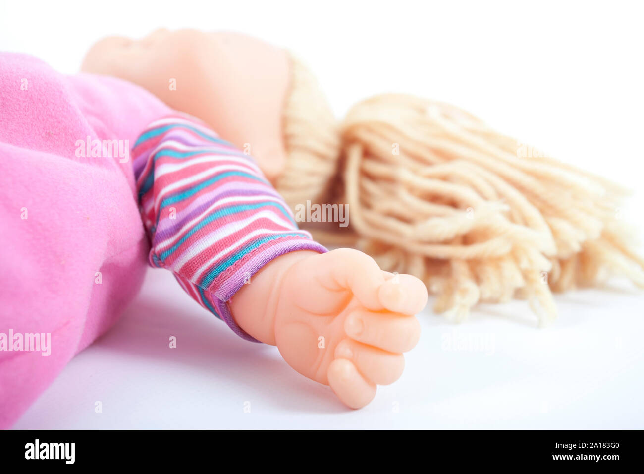 toy doll laying on its back Stock Photo