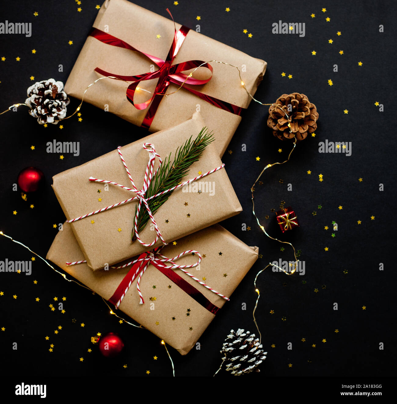 Christmas craft gift boxes with red ribbons, pine cones and red and ...