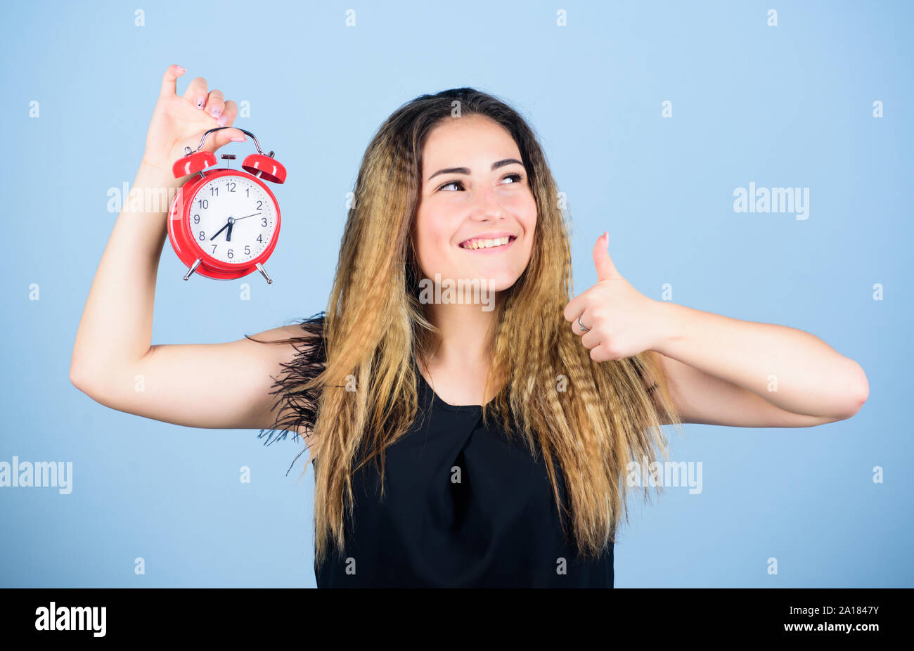 Daylight saving time. Change time zone. Pretty girl managing her time