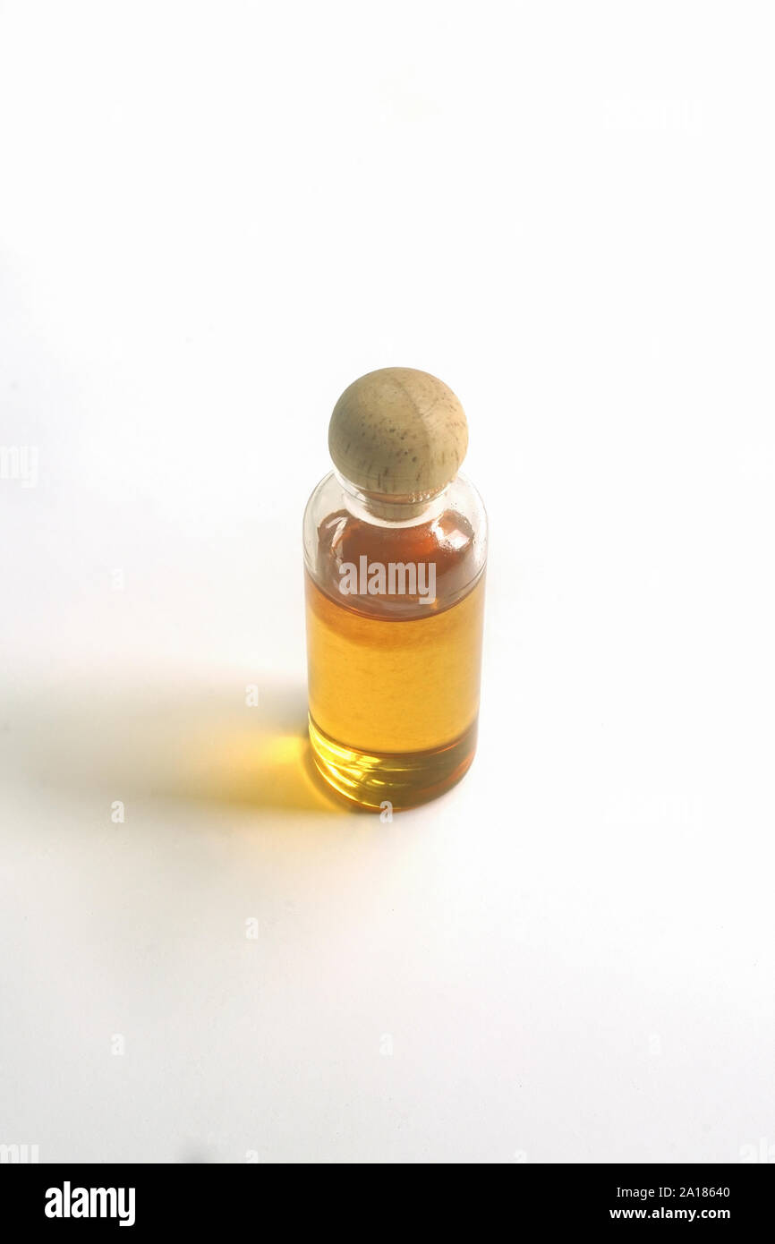 Closed up Honey in a small bottle on white background. Stock Photo