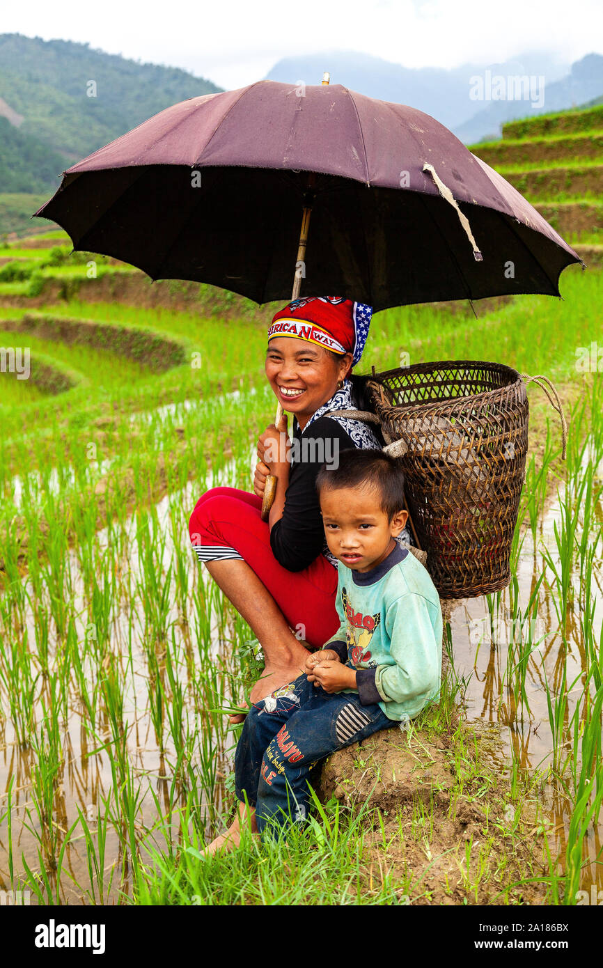 Mother and son, in a rice field. Mu Cang Chai area, Yen Bai province, in northwestern part of Vietnam. Stock Photo