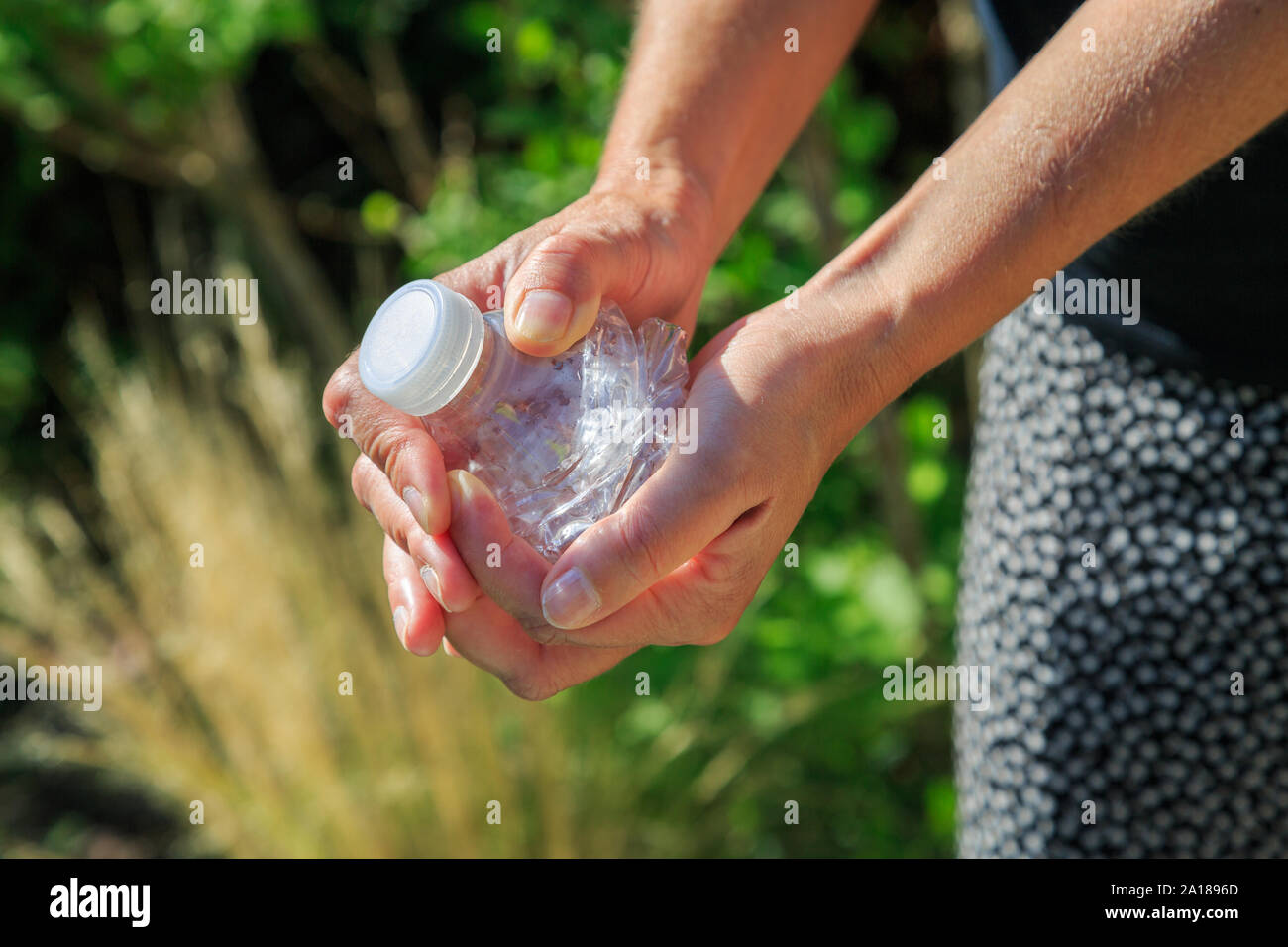 Crushing water bottle hires stock photography and images Alamy