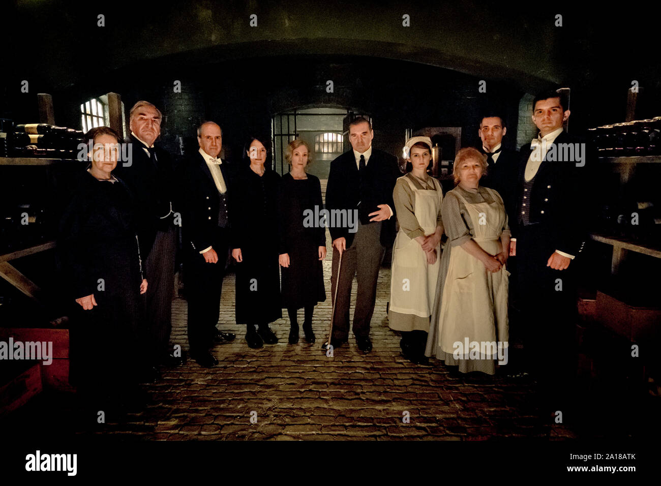 (L to R) Phyllis Logan stars as Mrs. Hughes, Jim Carter as Mr. Carson, Kevin Doyle as Mr. Molesley, Raquel Cassidy as Miss Baxter, Joanne Froggatt as Anna Bates, Brendan Coyle as Mr. Bates, Sophie McShera as Daisy, Lesley Nicol as Mrs. Patmore, Robert James-Collier as Thomas Barrow and Michael C. Fox as Andy in DOWNTON ABBEY, a Focus Features release. (2019)  Credit : Jaap Buitendijk / Focus Features, LLC /The Hollywood Archive Stock Photo