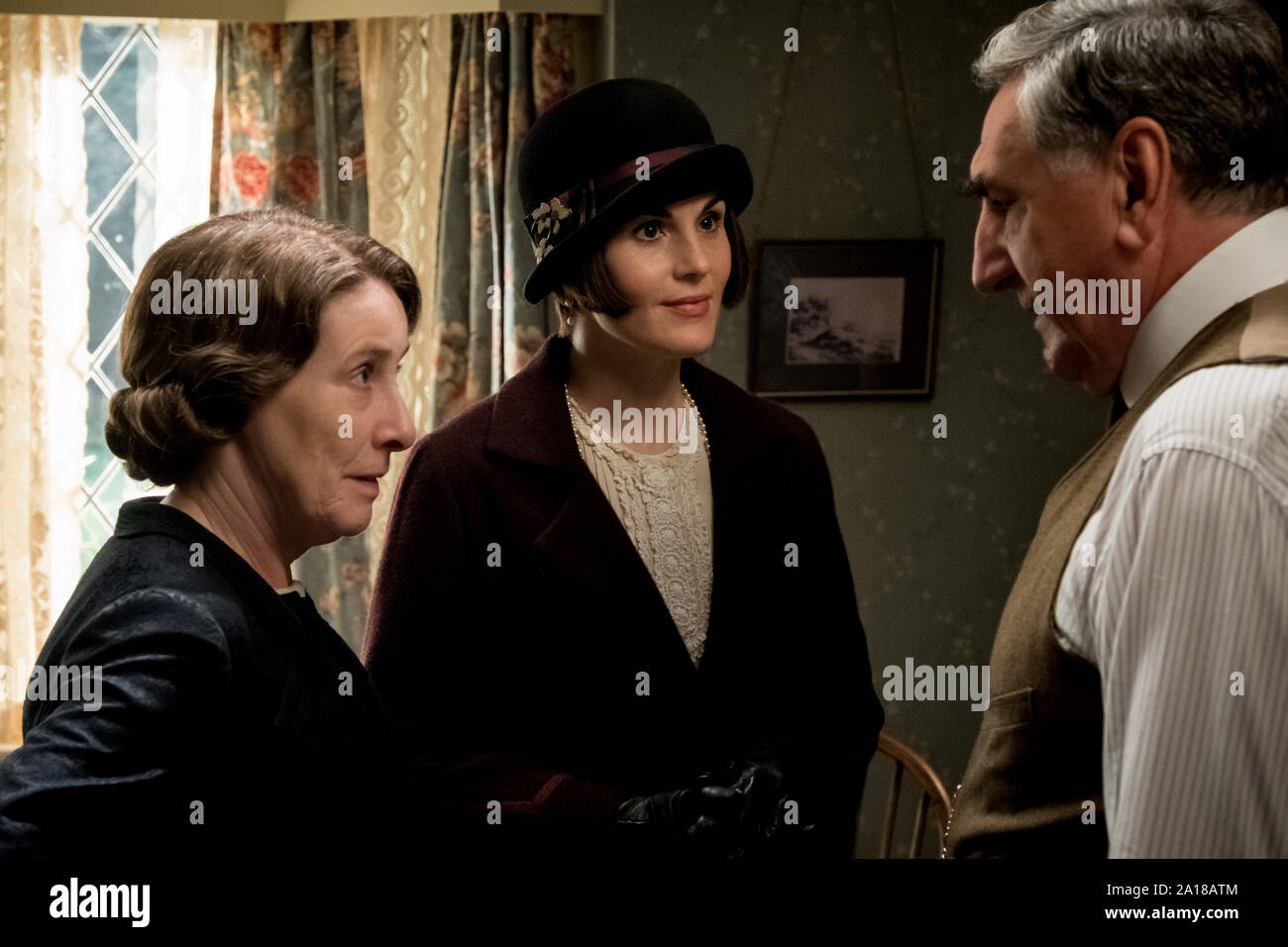 Phyllis Logan stars as Mrs. Hughes, Michelle Dockery as Lady Mary Talbot and Jim Carter as Mr. Carson in DOWNTON ABBEY, a Focus Features release. (2019)  Credit : Jaap Buitendijk / Focus Features, LLC/The Hollywood Archive Stock Photo