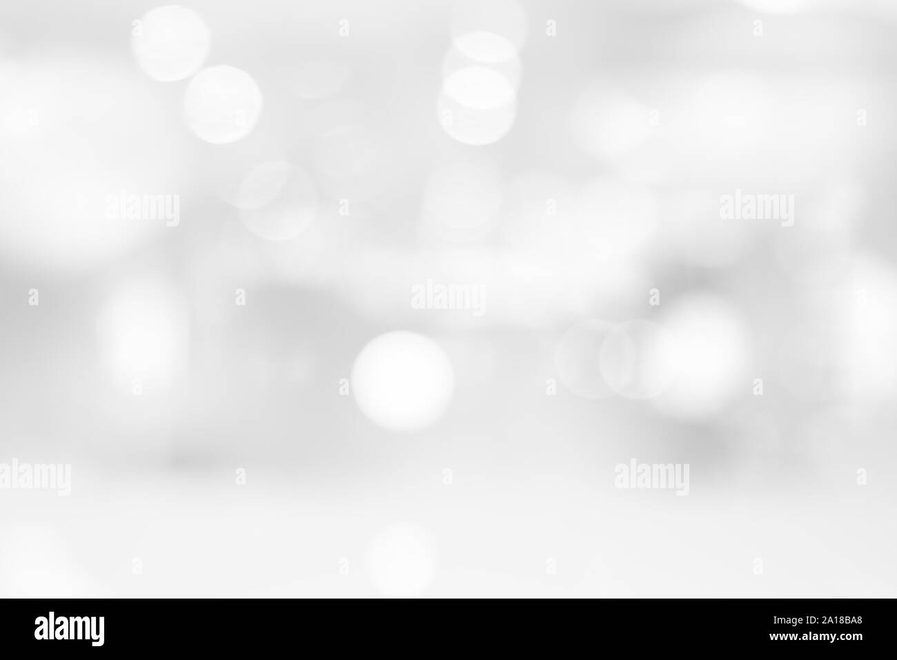 Abstract black and white bright bokeh background with white table top for backdrop design, bokeh composition for , website, magazine or graphic for Stock Photo