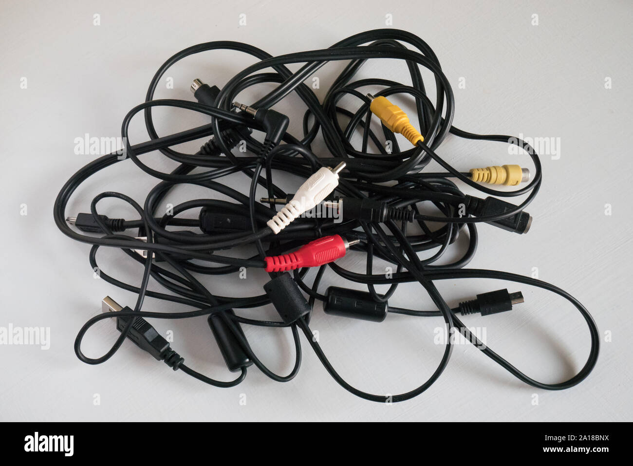 Messy tangle of old electric cords Stock Photo