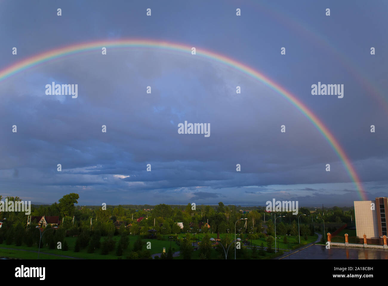 Double rainbow on the background of blue clouds after the rain Stock ...