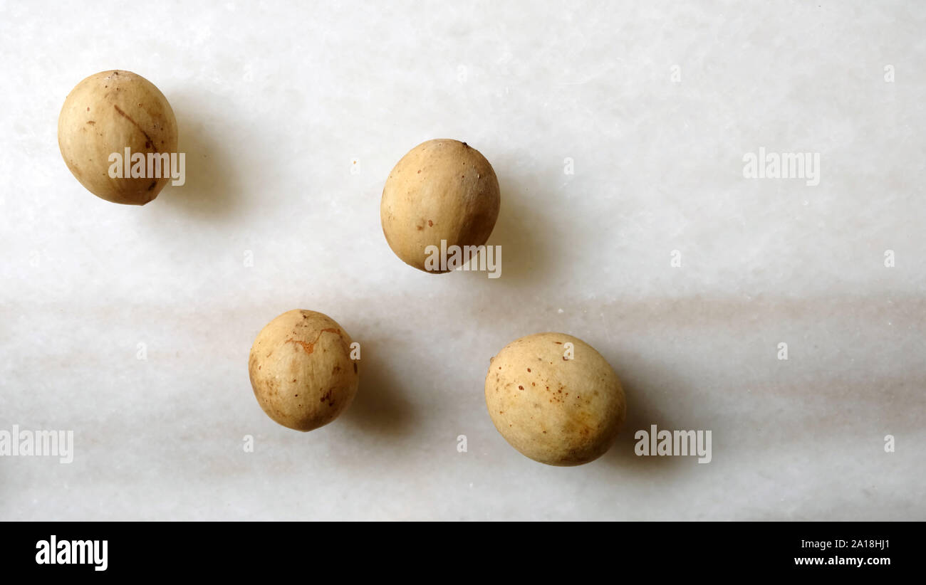 Langsat or lanzones, an edible tropical fruit. Scientic name Lansium parasiticum. Stock Photo