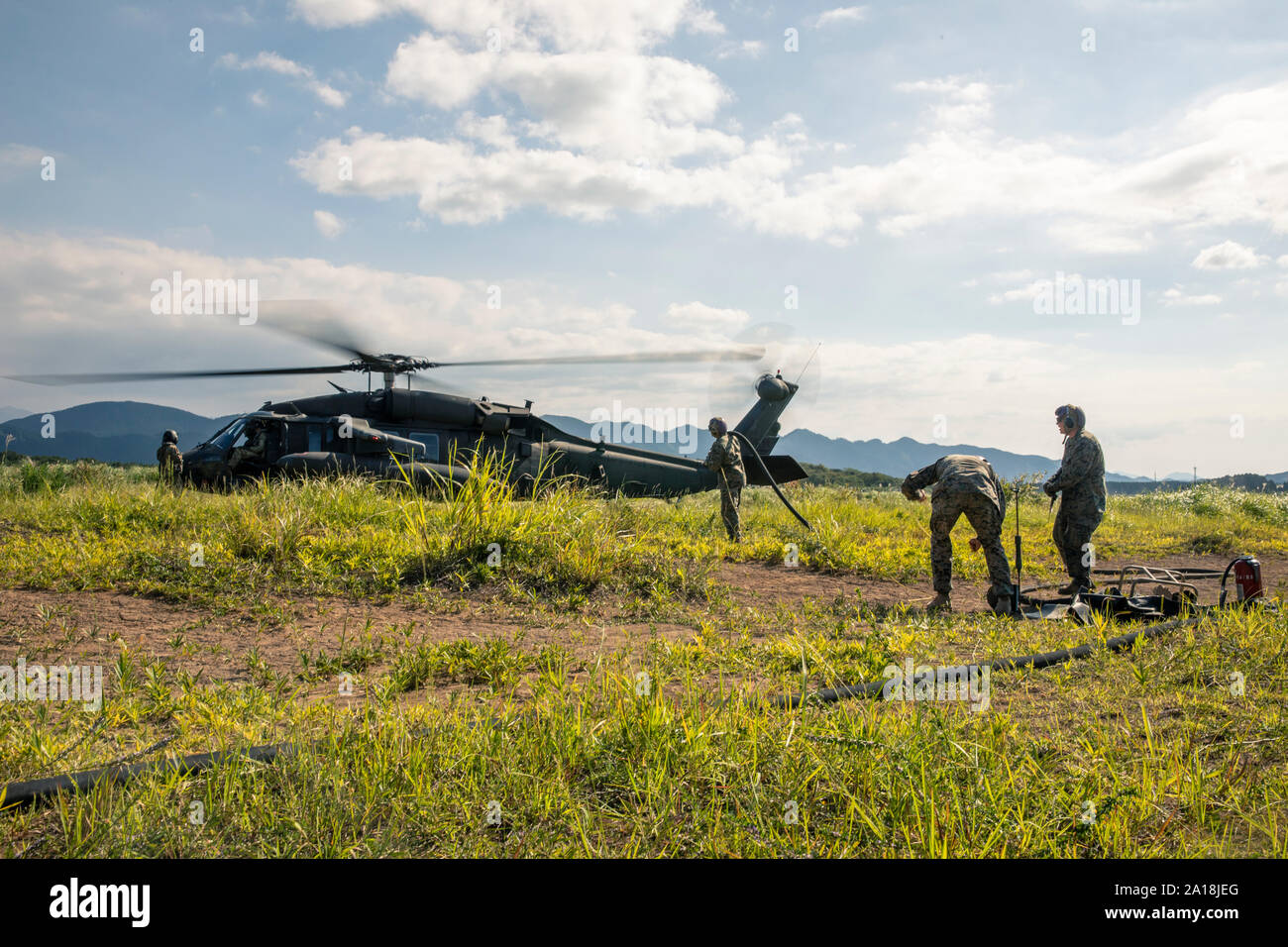 U.S. Marines with Marine Wing Support Squadron (MWSS) 171 establish a forward arming and refueling point in support of U.S. Army pilots-in-training during exercise Orient Shield in Kumomoto, Japan, Sep. 16, 2019.  Orient Shield is an annual joint force training exercise involving the U.S. Army and MWSS 171 where they perform landing and refueling training. (U.S. Marine Corps photo by Lance Cpl. Triton Lai) Stock Photo