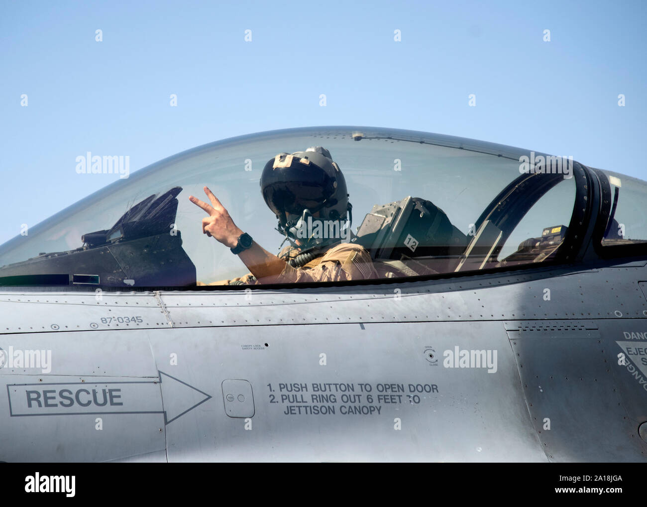 Lt. Col. Stalker, pilot for the 176th Expeditionary Fighter Squadron, deployed to Bagram Airfield, Afghanistan, taxis the F-16C aircraft after his 221st combat sortie, where he reached 1,000 combat flight hours. Less than 10 pilots under the rank of Colonel have logged 1,000 combat flying hours. (U.S. Air Force photo by Tech. Sgt. Isaac Garden/Released) Stock Photo