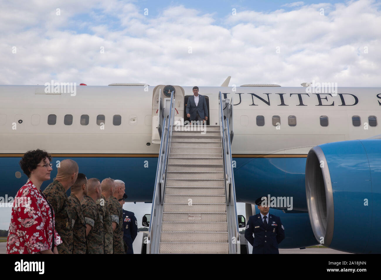 Secretary of Defense Dr. Mark Esper exits the plane at Marine Corps Air Station New River, N.C. Sept. 24 2019. Esper visited major operational commands and toured the base to view residual Hurricane Florence damage. (U.S. Marine Corps photo by Lance Cpl. Nicholas Guevara) Stock Photo