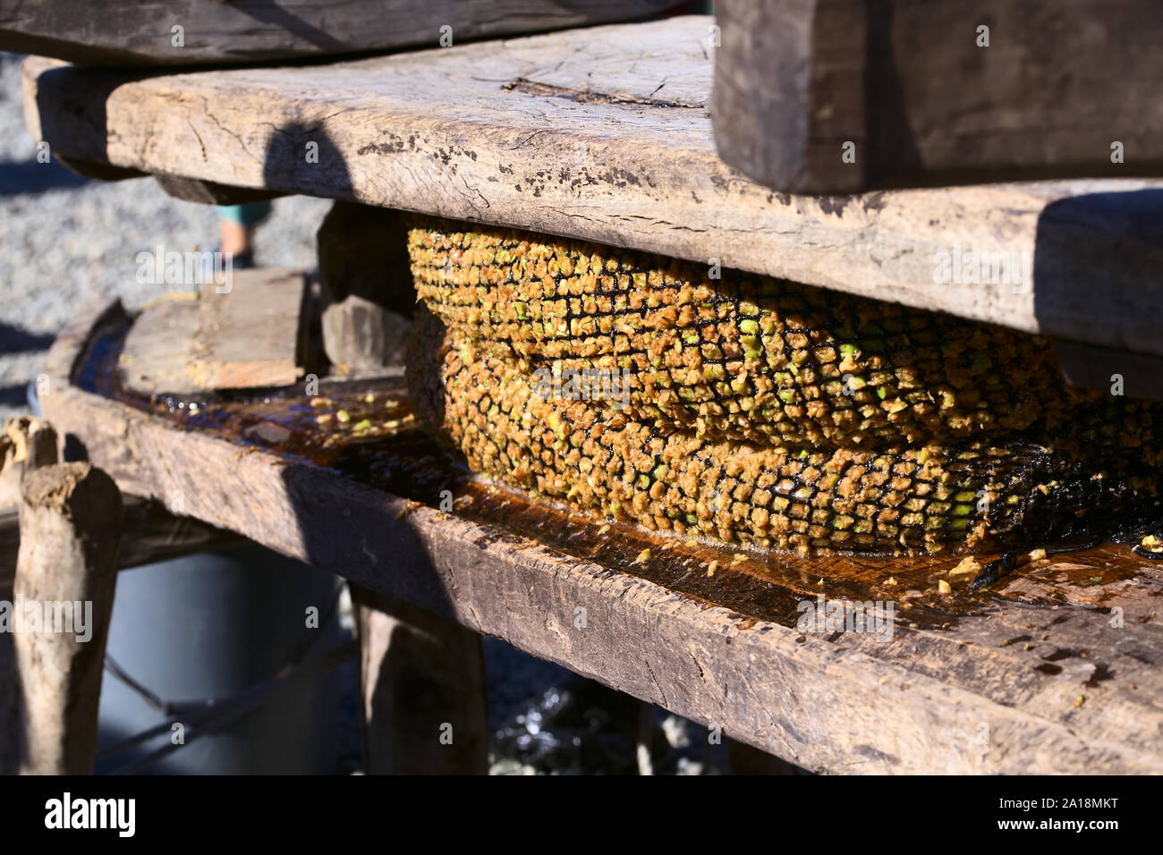 ACHAO, CHILE - FEBRUARY 6, 2016: Traditional apple juice press at the Muestras Gastronomicas 2016 Gastronomy Show in Achao, Chiloe Archipelago, Chile. Stock Photo