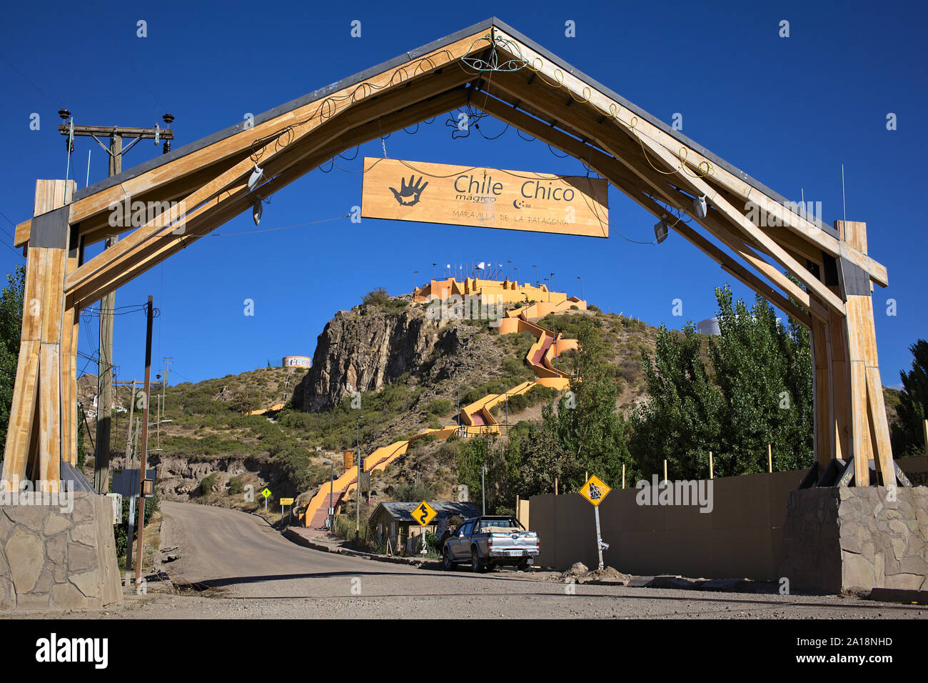 CHILE CHICO, CHILE - FEBRUARY 21, 2016: Wooden arch on O'Higgins Street with view onto the Plaza del Viento lookout in Chile Chico, Chile on February Stock Photo
