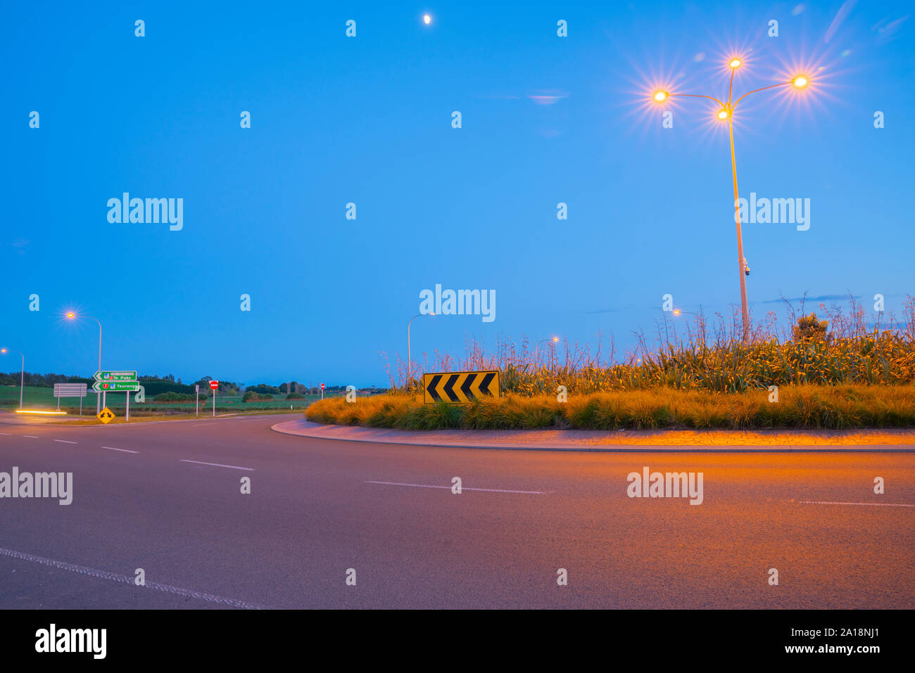 Intersection and roundabout at Papamoa Tauranga in morning light with