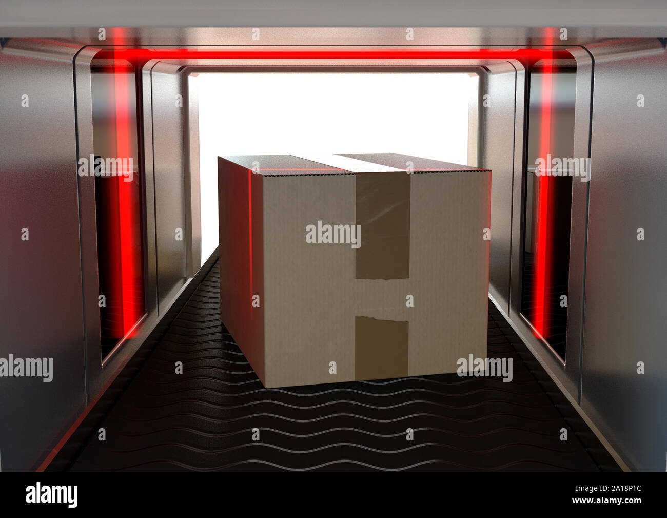 A cardboard box being examined by red lights while going through a