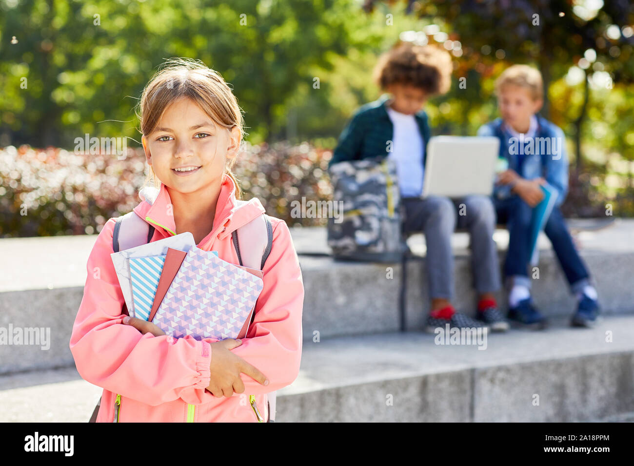 School children holding books in library Stock Photo - Alamy