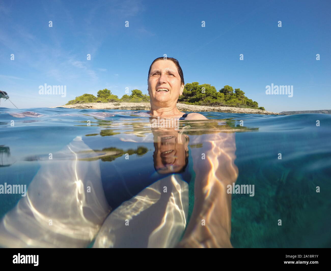 Mature woman swimming hi-res stock photography and images - Alamy