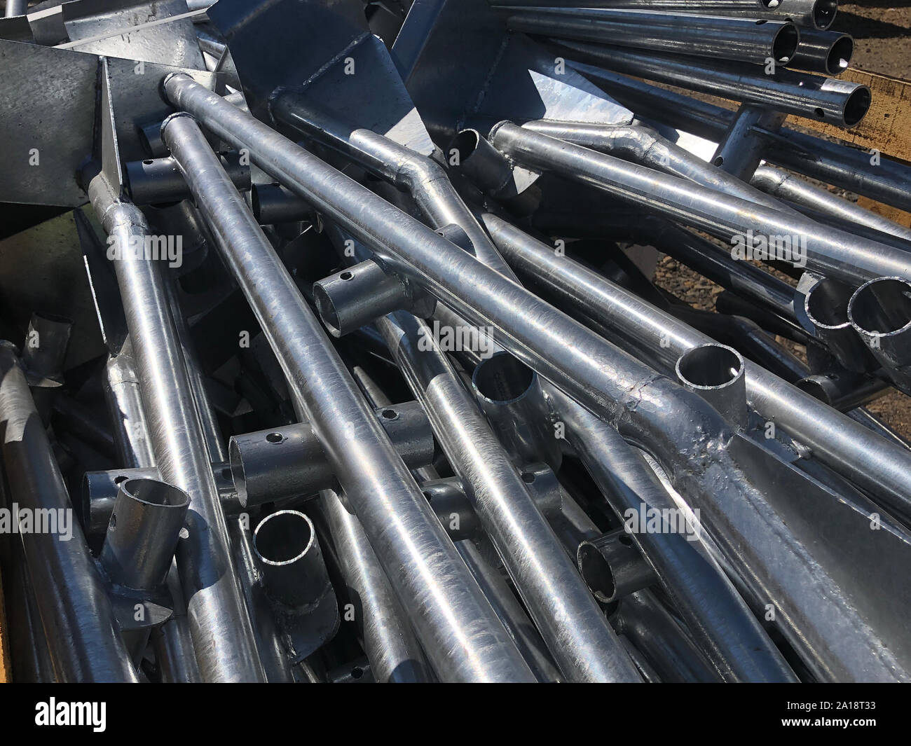 Chrome plated formwork supporting metal pipes in the box on the outdoor