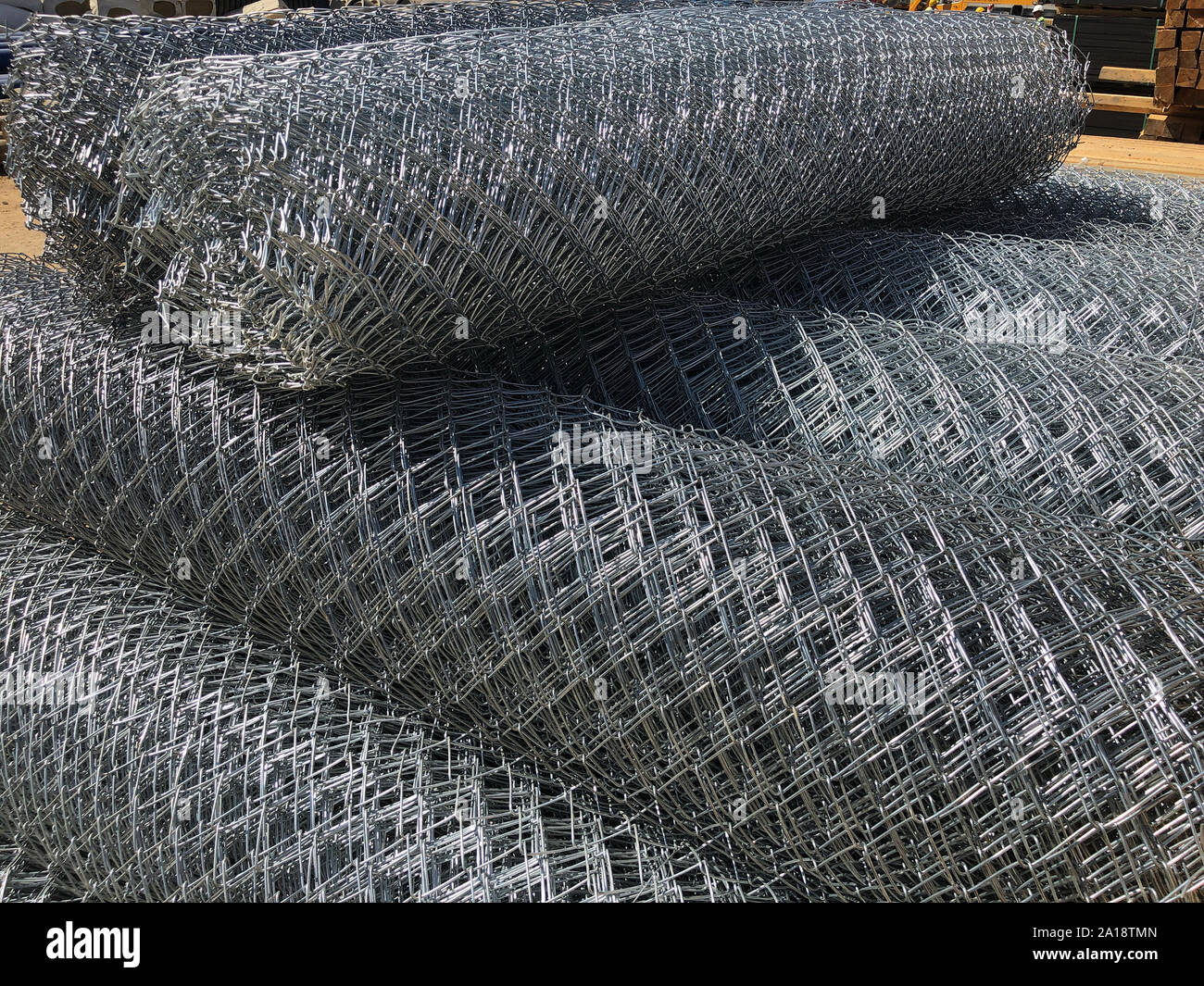 Rolled chainlink fence. Metal mesh netting rolled into rolls Stock