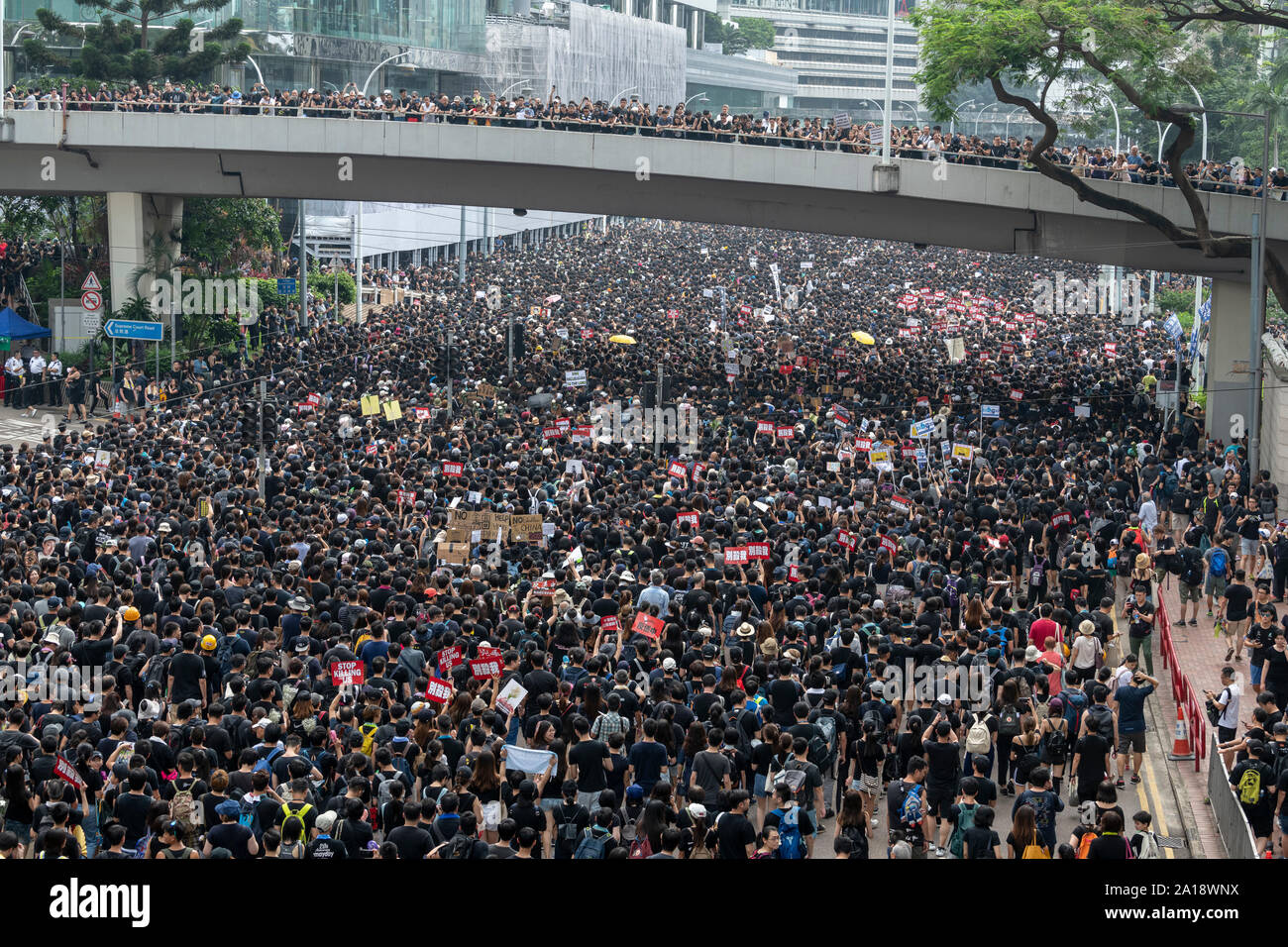 The march passes Pacific Place in Admiralty where a protester called Raincoat man fell to his death after opening a protest banner on the building. Ma Stock Photo