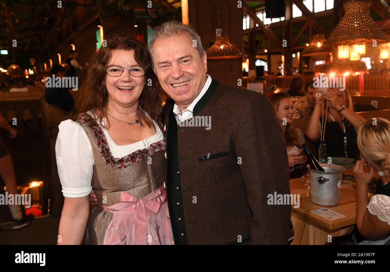 24 September 2019, Bavaria, Munich: Oktoberfest 2019, The musician of the 'Spider Murphy Gang' Günther Sigl and his wife Doris celebrate in the wine tent at the 'Fernsehen mit Herz' Wiesn of Mainstream Media AG. The largest folk festival in the world lasts until 6 October. Photo: Felix Hörhager/dpa Stock Photo
