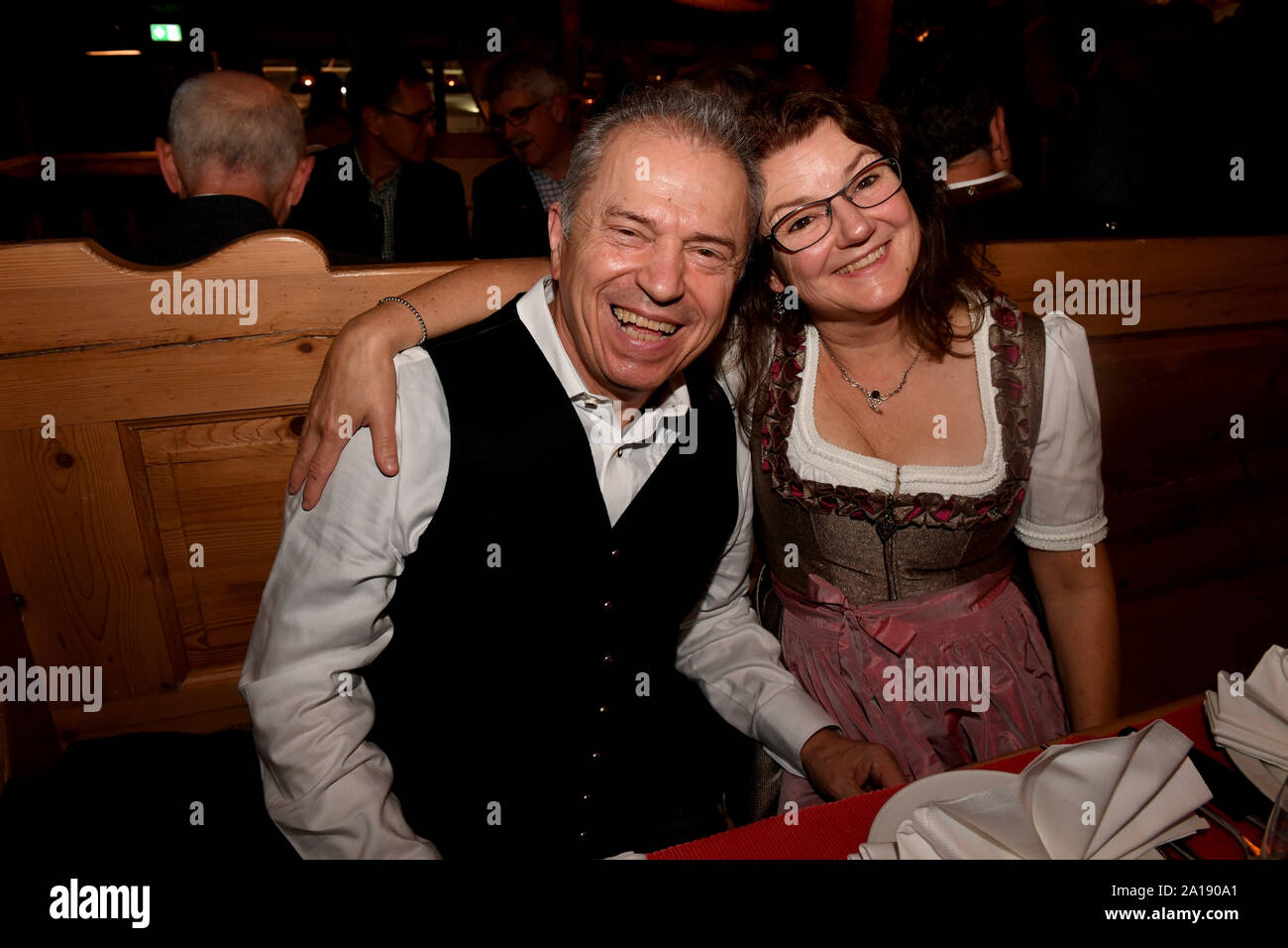 24 September 2019, Bavaria, Munich: Oktoberfest 2019, The musician of the 'Spider Murphy Gang' Günther Sigl and his wife Doris celebrate in the wine tent at the 'Fernsehen mit Herz' Wiesn of Mainstream Media AG. The largest folk festival in the world lasts until 6 October. Photo: Felix Hörhager/dpa Stock Photo